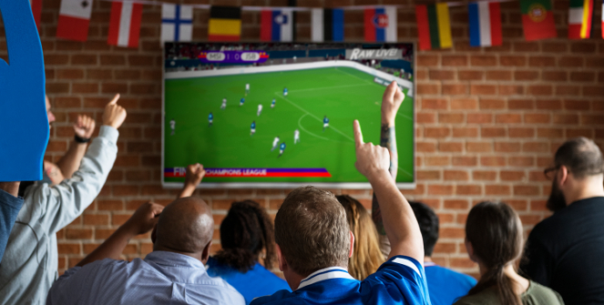 Fans watching football at a bar